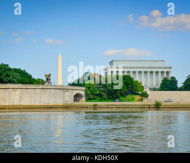 The Arts of Peace bronze statues seen from the Potomac river with the Washington monument and Lincoln Memorial in the background in Washington, DC, US Stock Photo