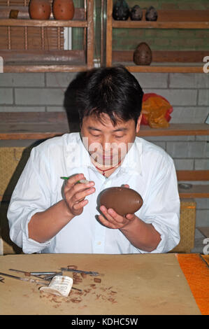 Terracotta Souvenir Show Room, Brushing of bits on Ceramic Ornament, Xian, Shaanxi, China, Asia, Stock Photo