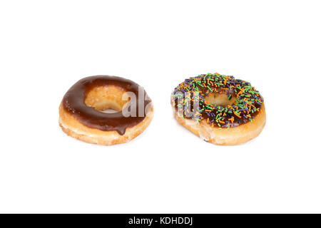 Close up detailed top view of yummy donuts with chocolate, powdered sugar and sweets, isolated on white background. Stock Photo