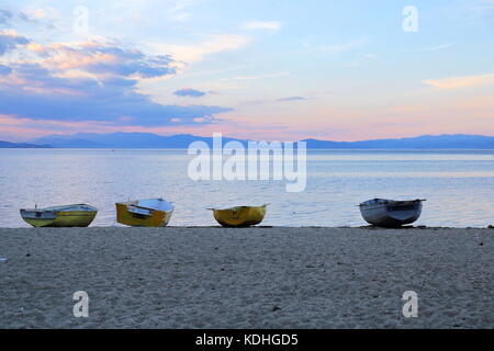 Wooden fishing boats moored on the beach of Lake Ohrid in Pogradec, Albania Stock Photo