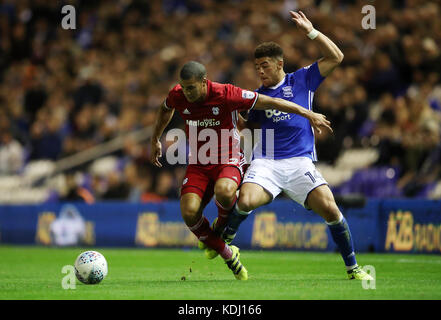 Cardiff City's Lee Peltier and Birmingham City's Che Adams (right) battle for the ball during the Sky Bet Championship match St Andrew's, Birmingham. Stock Photo