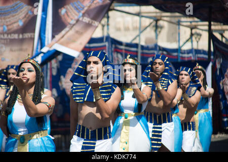 Alexandria, Egypt - 30 September 2017 - The inaugural festival in honor of Cleopatra coincided today with World Tourism Day.  The event included a parade along the corniche seafront with Cleopatra dressed in her golden royal robes and distinctive crown, accompanied by her two ladies-in-waiting and six officers dressed as ancient Egyptian soldiers.  The event also brings awareness about new discoveries made in the bottom of the Mediterranean Sea in the Alexandria area where 72 wrecks, 20 ships and army aircrafts from WWI and WWII and others that date back to 300 BC have been discovered.  An ini Stock Photo