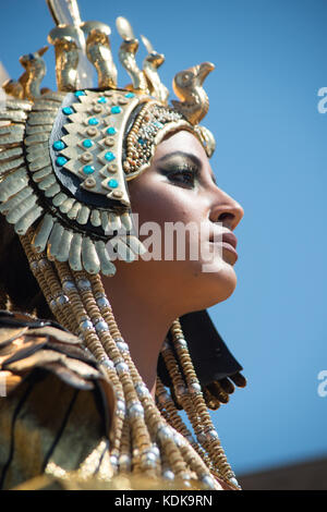 Alexandria, Egypt - 30 September 2017 - The inaugural festival in honor of Cleopatra coincided today with World Tourism Day.  The event included a parade along the corniche seafront with Cleopatra dressed in her golden royal robes and distinctive crown, accompanied by her two ladies-in-waiting and six officers dressed as ancient Egyptian soldiers.  The event also brings awareness about new discoveries made in the bottom of the Mediterranean Sea in the Alexandria area where 72 wrecks, 20 ships and army aircrafts from WWI and WWII and others that date back to 300 BC have been discovered.  An ini Stock Photo