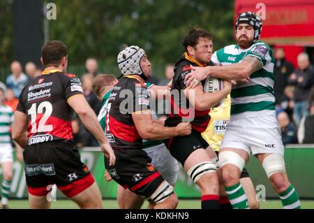 Newcastle upon Tyne, England, 14 October 2017. Gary Graham of Newcastle Falcons, right, tackling against Dragons in the European Rugby Challenge Cup at Kingston Park. Credit: Colin Edwards/Alamy Live News. Stock Photo