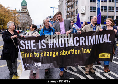 Belfast, Northern Ireland. 14/10/2017 - Protest banner 'She is #NotACriminal' within the Rally For Choice parade in support of pro-choice abortion rights and women's reproductive rights.  Approximately 1200 people attended the event. Stock Photo