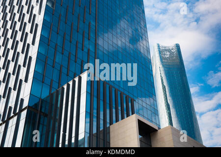 Modern business skyscrapers, high-rise buildings, architecture raising to the sky, sun. Concepts of financial, economics, future etc. Stock Photo