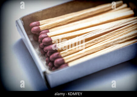 Some matches in a pasteboard box isolated on white fund Stock Photo