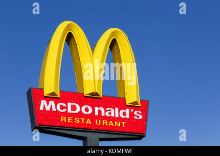 Horsens, Denmark - september 30, 2015: McDonald's logo on a pole. McDonald's is the world's largest chain of hamburger fast food restaurants Stock Photo