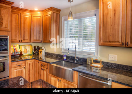 Stainless steel appliances in a modern, upscale kitchen in Vermont, USA. Stock Photo