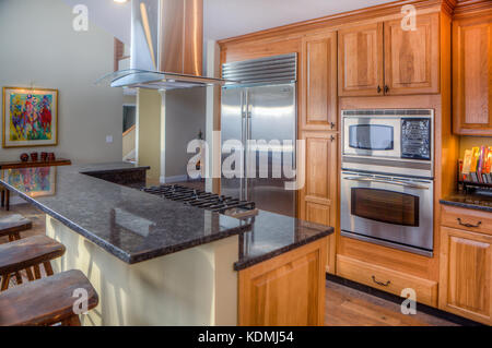 Stainless steel appliances in a modern, upscale kitchen in Vermont, USA. Stock Photo