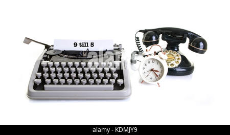 Old office Still life with retro typewriter, alarm clock, telephone on a white background with copy , space Stock Photo