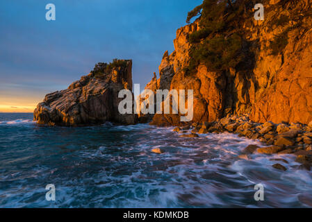 First sunbeams of the day in Cala s'Aguia on the Costa Brava area Stock Photo