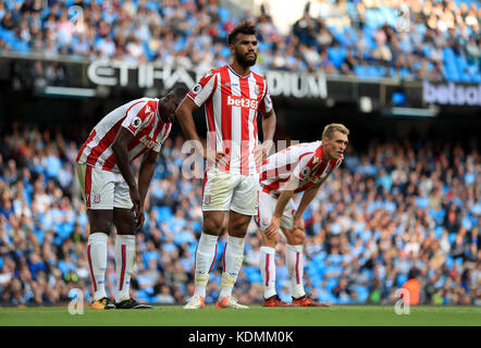 Stoke City's Eric Maxim Choupo-Moting, Darren Fletcher (right) and their team-mates appear dejected during the Premier League match at Etihad Stadium, Manchester. Stock Photo