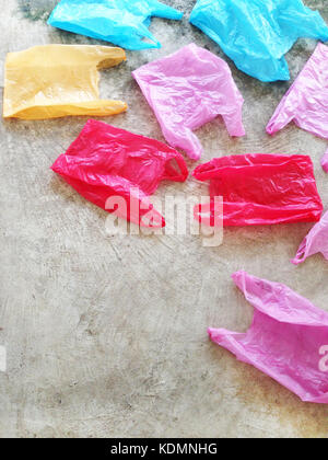 Colorful plastic bag on cement floor Stock Photo