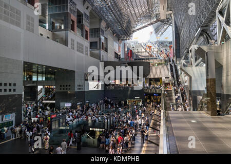 Kyoto, Japan - May 20, 2017:  Interior of the crowded train station in Kyoto, it is a major railway station and transportation hub, designed by Hirosh Stock Photo