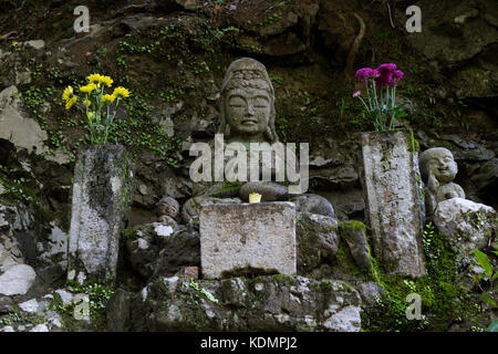 Kyoto - Japan, May 22, 2017:  Traditional stone Jizo Bosatsu statues at arashiyama city in Kyoto, Japan Stock Photo