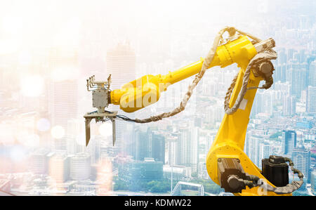 Heavy automation robot arm machine in smart factory industrial. Industry 4th iot and smart logistic , construction  concept with abstract blur bokeh b Stock Photo