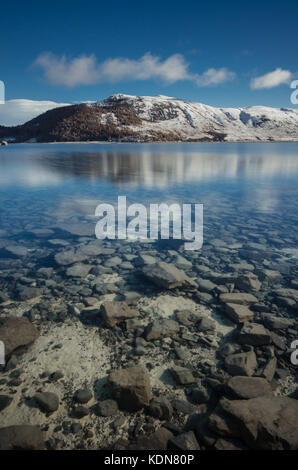 Beautiful morning at Lake Tekapo, New Zealand. This picture is taken during winter season, mountain at the back are covered with snow. Stock Photo