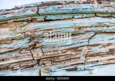 Wodden texture with old blue paint on abandoned fishing boat Stock Photo