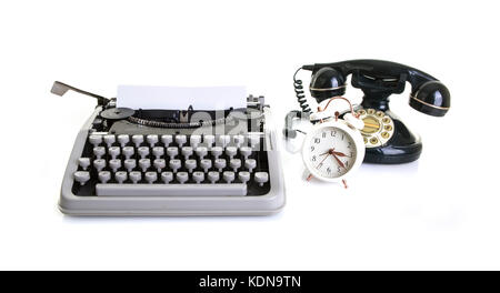 Old office Still life with retro typewriter, alarm clock, telephone on a white background with copy , space Stock Photo