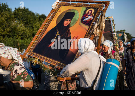 Cross Procession from Kamianets-Podilsky to the Holy Dormition Pochaev Lavra, August 19 - 25, 2017, Ukraine. For more than 150 years the procession gathered thousands of pilgrims who would cross the path of 210 kilometers during 7 days. Over 20 thousand believers took part in the event this year. Stock Photo