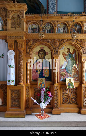 The wooden iconostasis with icons and religious paintings depicting Jesus Christ inside the church at the Holy monastery of St Stephen Greek Orthodox Patriarchate in Kidron Valley East Jerusalem Israel Stock Photo