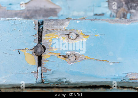 Wodden texture with old blue paint on abandoned fishing boat Stock Photo