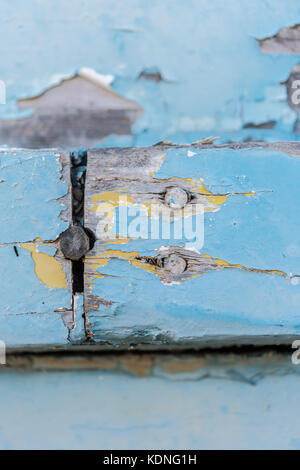 Wodden texture with old blue paint on abandoned fishing boat Stock Photo