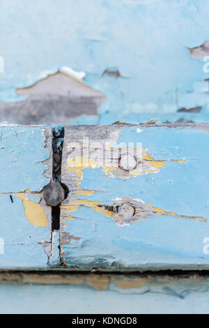 Wodden texture with old blue paint on abandoned fishing boat Stock Photo