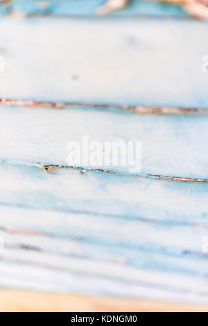 Wodden texture with old blue paint on abandoned fishing boat Stock Photo