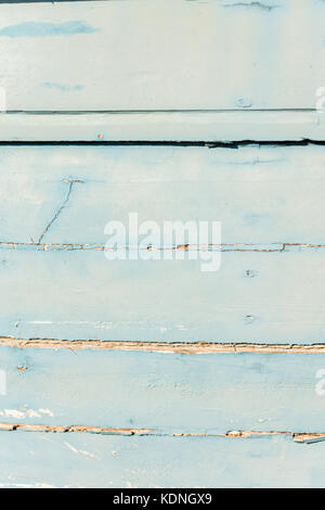 Wodden texture with old blue paint on abandoned fishing boat Stock Photo