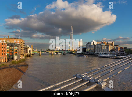 London - The Thames riverside and Shard from Millenium bridge in evening light. Stock Photo