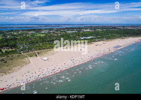 Italy, the beach of the Adriatic sea. Rest on the sea near Venice. Aerial FPV drone photography. Stock Photo