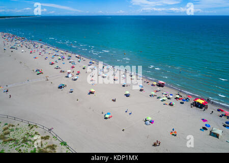 Italy, the beach of the Adriatic sea. Rest on the sea near Venice. Aerial FPV drone photography. Stock Photo