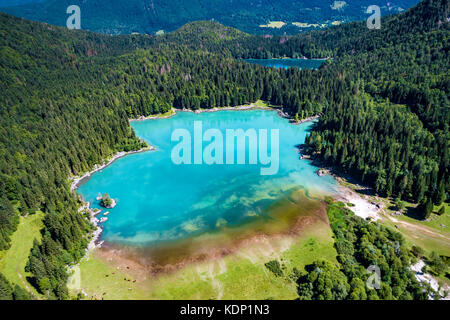 Lake Lago di Fusine Superiore Italy Alps. Aerial FPV drone flights. Stock Photo