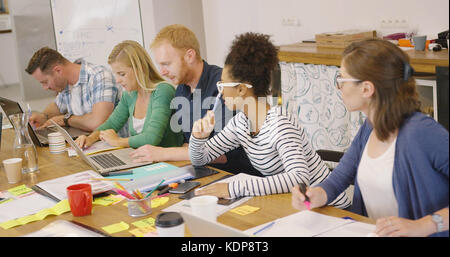 Coworkers in process of creation Stock Photo