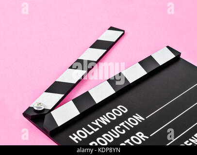 Blank movie production clapper board or slate film over pink background with copy space. Stock Photo