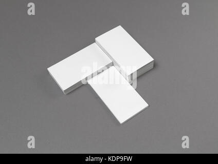 Empty blank business cards on gray paper background. Stock Photo