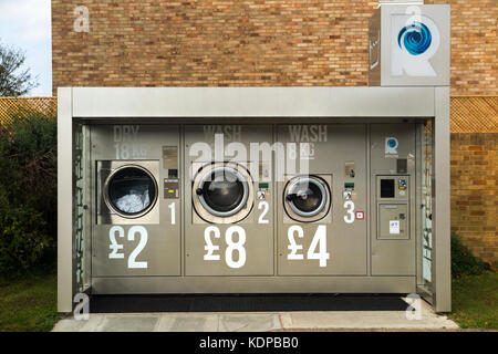 Revolution 24/7 outdoor self-service launderette laundry / launderette in grounds / forecourt of Esso petrol station, Twickenham. London. UK. (90) Stock Photo