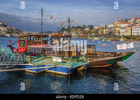 Sandeman and Offley Port wine companies tourist boat on Douro River in Vila Nova de Gaia city, Portugal Stock Photo