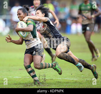 Colombo, Sri Lanka. 15th Oct, 2017. Player of Sri Lanka is tackled by Player of  Singapore during the Asia Rugby Women's Sevens 2017 match between Sri Lanka and Singapore at Race Course Ground on 15 October 2017 in Colombo, Sri Lanka. Credit: Lahiru Harshana/Alamy Live News