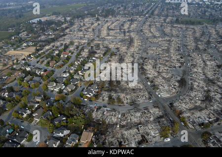 The remains of a housing development after fires swept through the neighborhood destroying some homes but leaving others intact October 14, 2017 in Santa Rosa, California. Stock Photo
