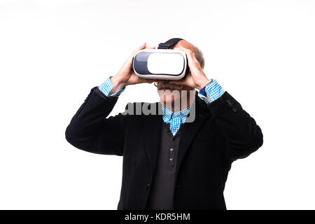 Studio shot of a cheerful senior using a VR headset isolated on white Stock Photo