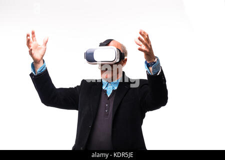 excited senior bearded man gesturing and using virtual reality headset Stock Photo