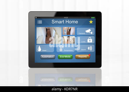 Digital Tablet Showing Home Automation System On White Desk Stock Photo