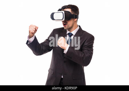 Young handsome businessman in black suit wearing virtual reality goggles., isolated on white background Stock Photo