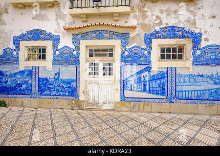 The Aveiro Railway station is Historic building ornamented with many typical blue Azulejos panels of Factory Fabrica da Fonte Nova displaying regional Stock Photo