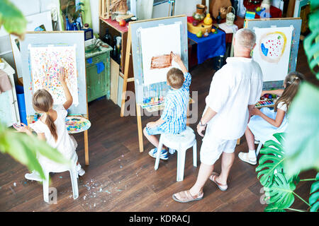 Children Painting in Art Studio Stock Photo