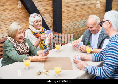 Senior People Playing Cards Stock Photo
