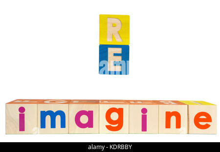 RE IMAGINE concept spelled out with toy blocks. Isolated. Stock Photo